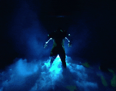 Person in Dark Room With Blue Light
