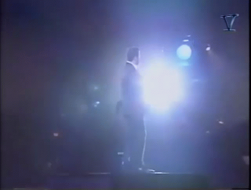 Person in Dark Room With Blue Light