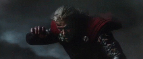 Person In Dark Room With Red Chest Light GIF