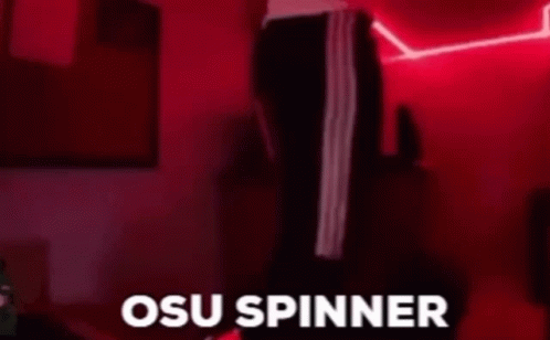 Person in Dark Room With Red Lights and osu Spinner