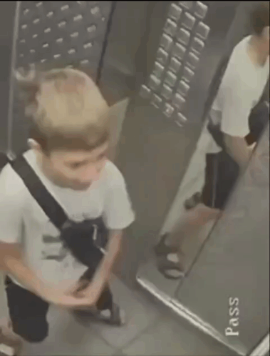 Person in Elevator With Pass