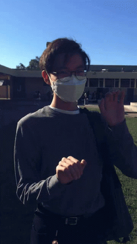 Person in Face Mask and Glasses