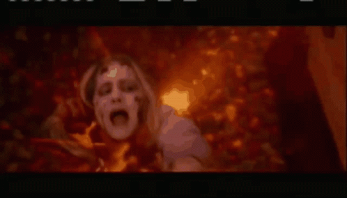 Person in Fire With Hands Outstretched Movie Scene