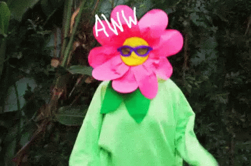 Person In Flower Costume And Sunglasses In Woods GIF