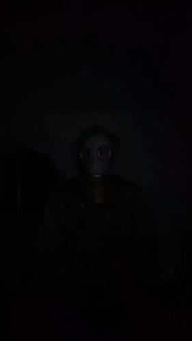 Person in Gas Mask and Hood