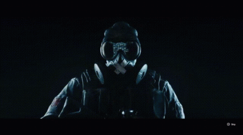 Person in Gas Mask in Dark Room