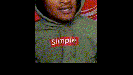 Person in Green Hoodie with Red Box Logo