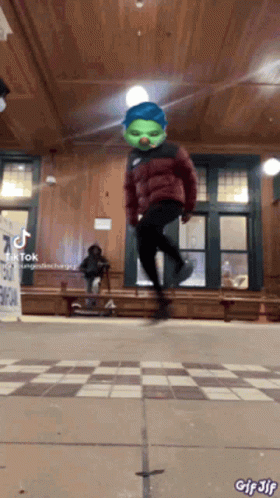 Person In Green Mask Jumping GIF