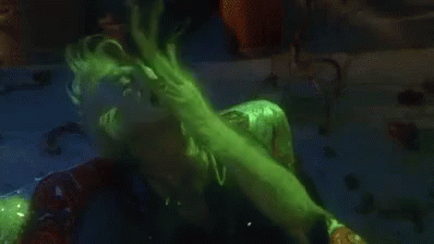 Person in Green Suit Eating Because Bored