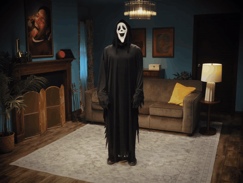 Person in Grim Reaper Costume in Living Room