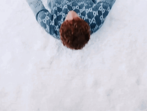 Person In Gucci Sweater Lying In Snow GIF