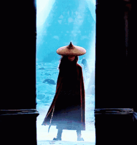 Person in Hat and Cape Standing in Snow