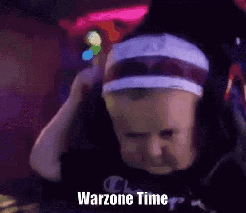 Person in Headband and Hat Playing Warzone Time