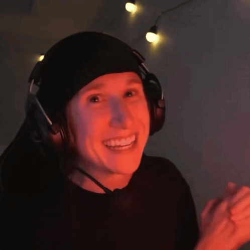 Person In Headphones And Beanie Smiling GIF