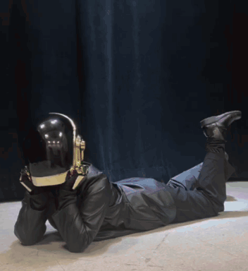 Person in Helmet and Headphones Lying on Ground