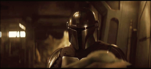 Person in Helmet Standing in Dark Room