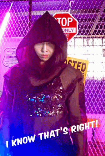 Person in Hooded Jacket at Stop Sign