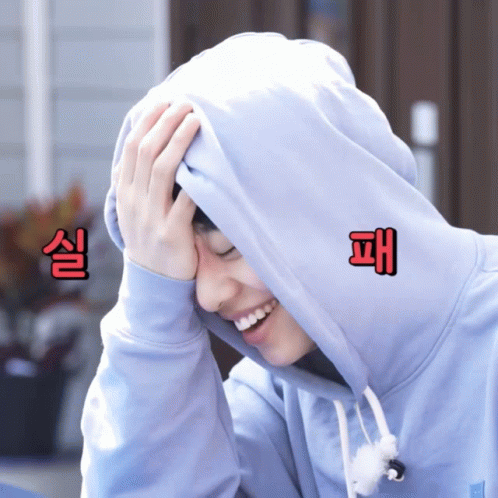 Person in Hooded Sweatshirt With Chinese Characters