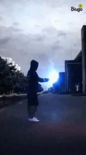 Person in Hoodie with Blue Light