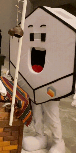 Person in House Costume Holding Stick