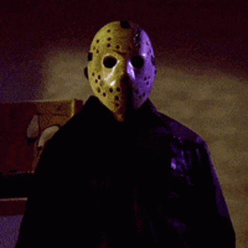 Person in Jason Voorhees Mask and Black Jacket