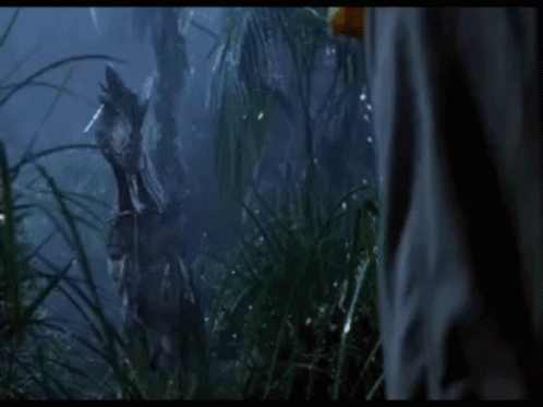 Person In Jungle With Dinosaur Statue GIF