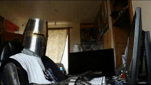 Person in Knight's Helmet at Computer