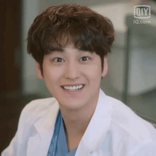 Person In Lab Coat Smiling GIF
