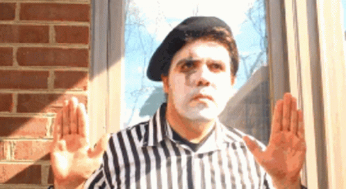Person in Mime Mask Covering Eyes