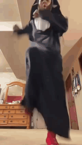 Person in Nun Costume Jumping