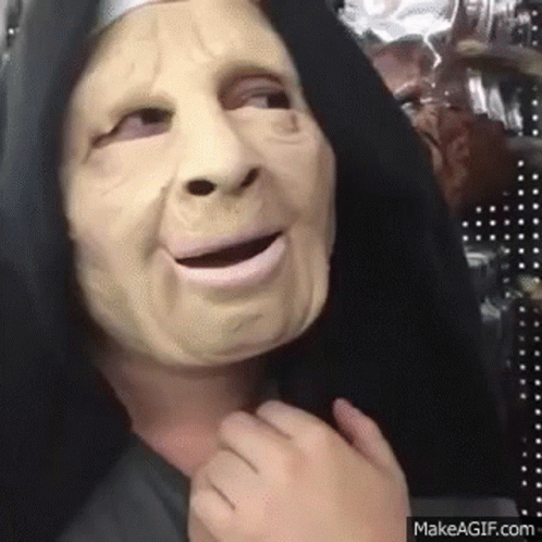 Person in Nun Mask and Black Hood Making Funny Face