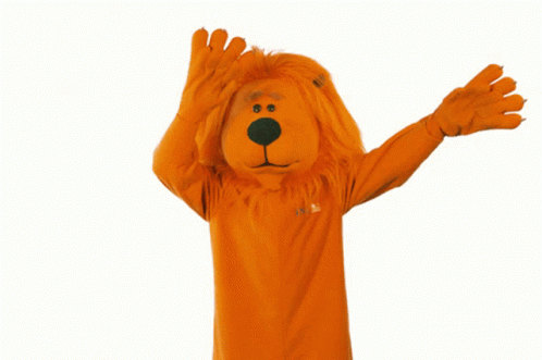 Person In Orange Lion Costume With Confetti GIF