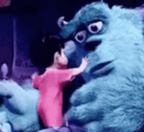 Person in Pink Shirt Hugging Stuffed Monster