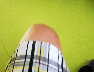 Person In Plaid Shirt On Green Floor GIF