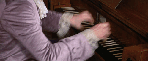 Person In Purple Shirt Playing Keyboard GIF