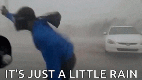 Person in Rain Saying It's Just a Little Rain