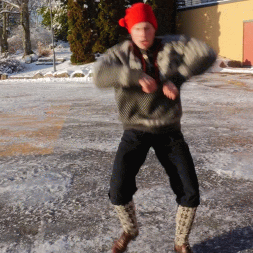 Person in Red Hat Dancing in Snow