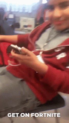 Person in Red Hoodie Playing Fortnite