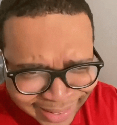 Person in Red Shirt and Glasses