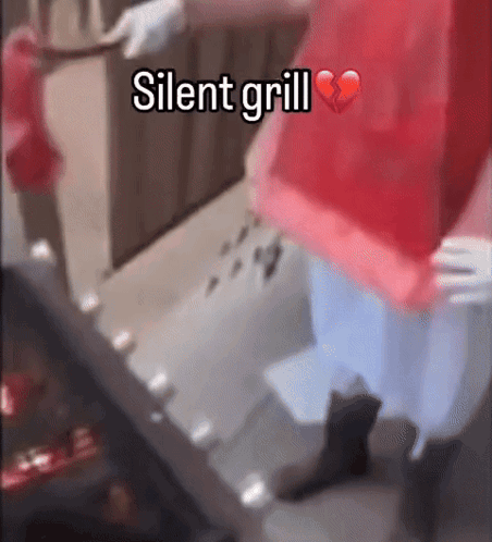 Person in Red Shirt at Grill with Broken Heart