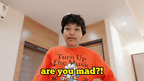 Person in Red Shirt Saying Turn Up the Music