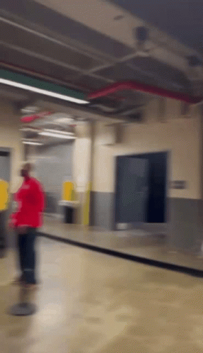 Person In Red Shirt Walking GIF