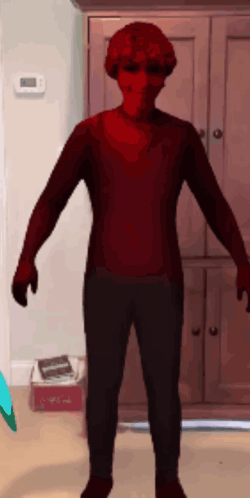 Person in Red Sweater and Black Pants