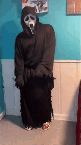 Person In Scream Costume Holding Knife GIF