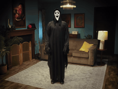 Person In Scream Costume Standing In Living Room GIF
