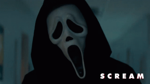 Person in Scream Ghostface Mask