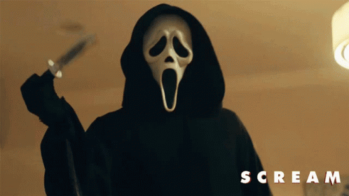Person in Scream Mask Holding Knife