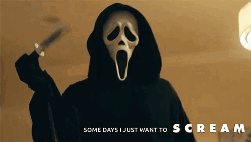 Person in Scream Mask Holding Knife