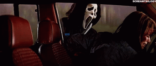 Person in Scream Mask in Car Back Seat