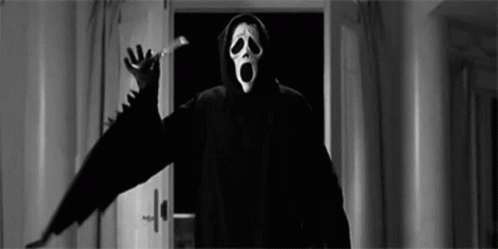 Person In Scream Mask Standing By Door GIF